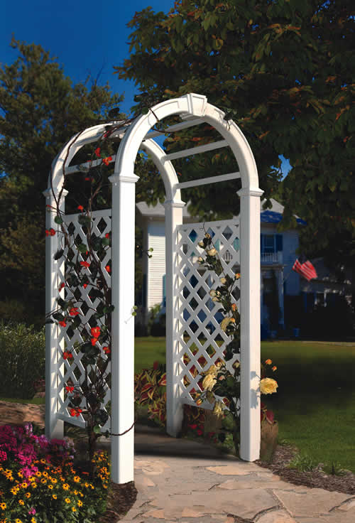 White arbor trellis installed on a walkway