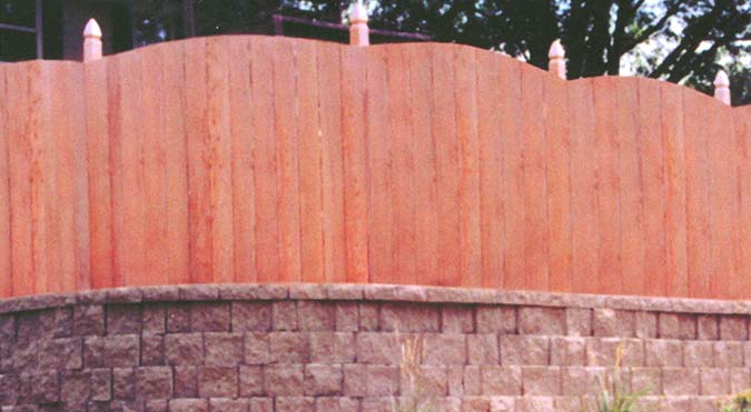 privacy fence above retaining wall