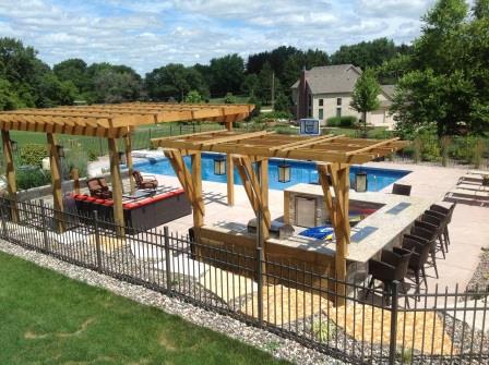 Fencing installed around a pool area on residential property in Waukesha